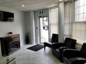 Red Rose Dentistry waiting room — comfortable modern dental office in Downtown Hamilton